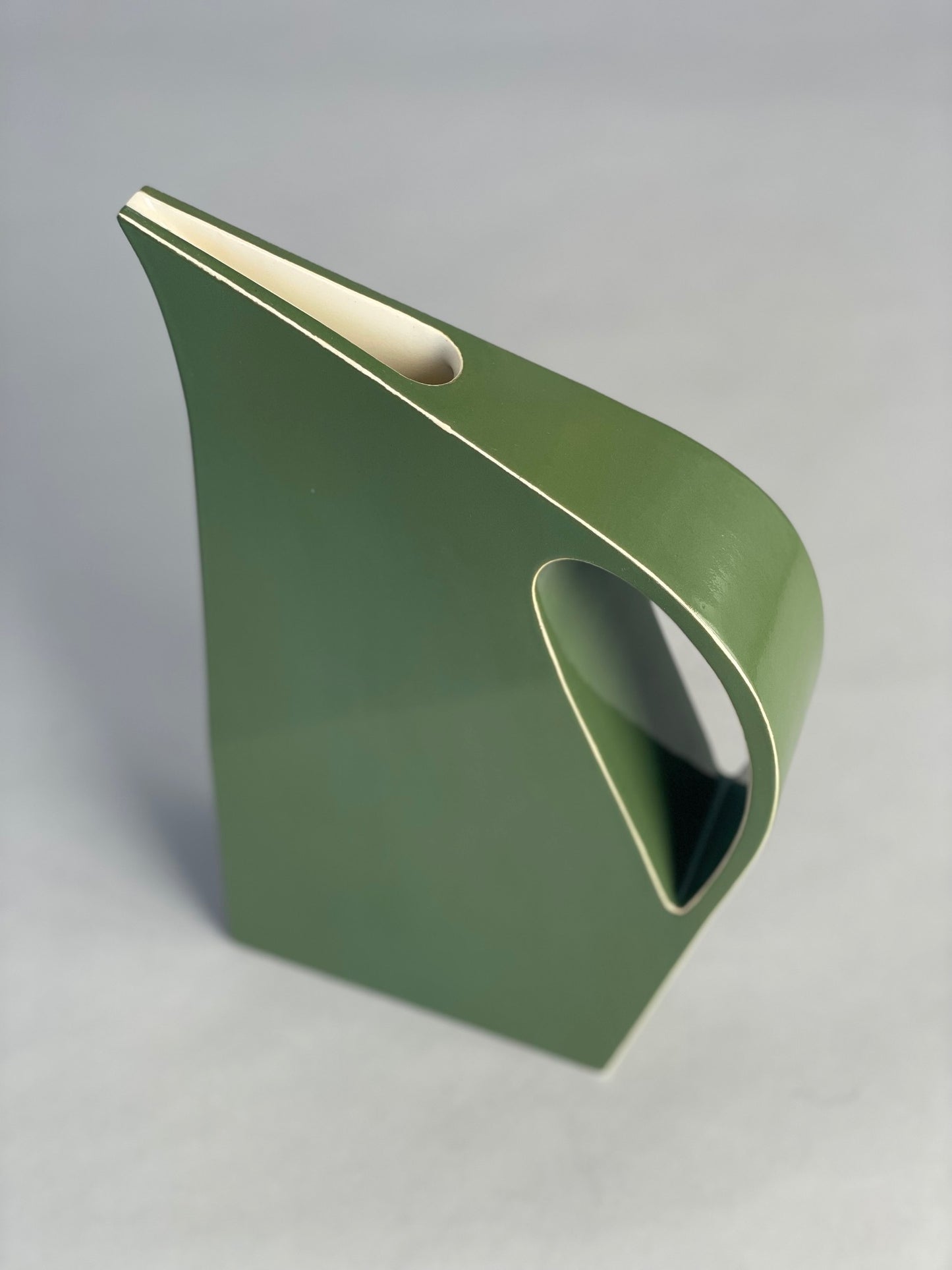 A top-down view of the Yuro Cuchor jug, highlighting its narrow opening and deep brown tones with a subtle glaze variation.