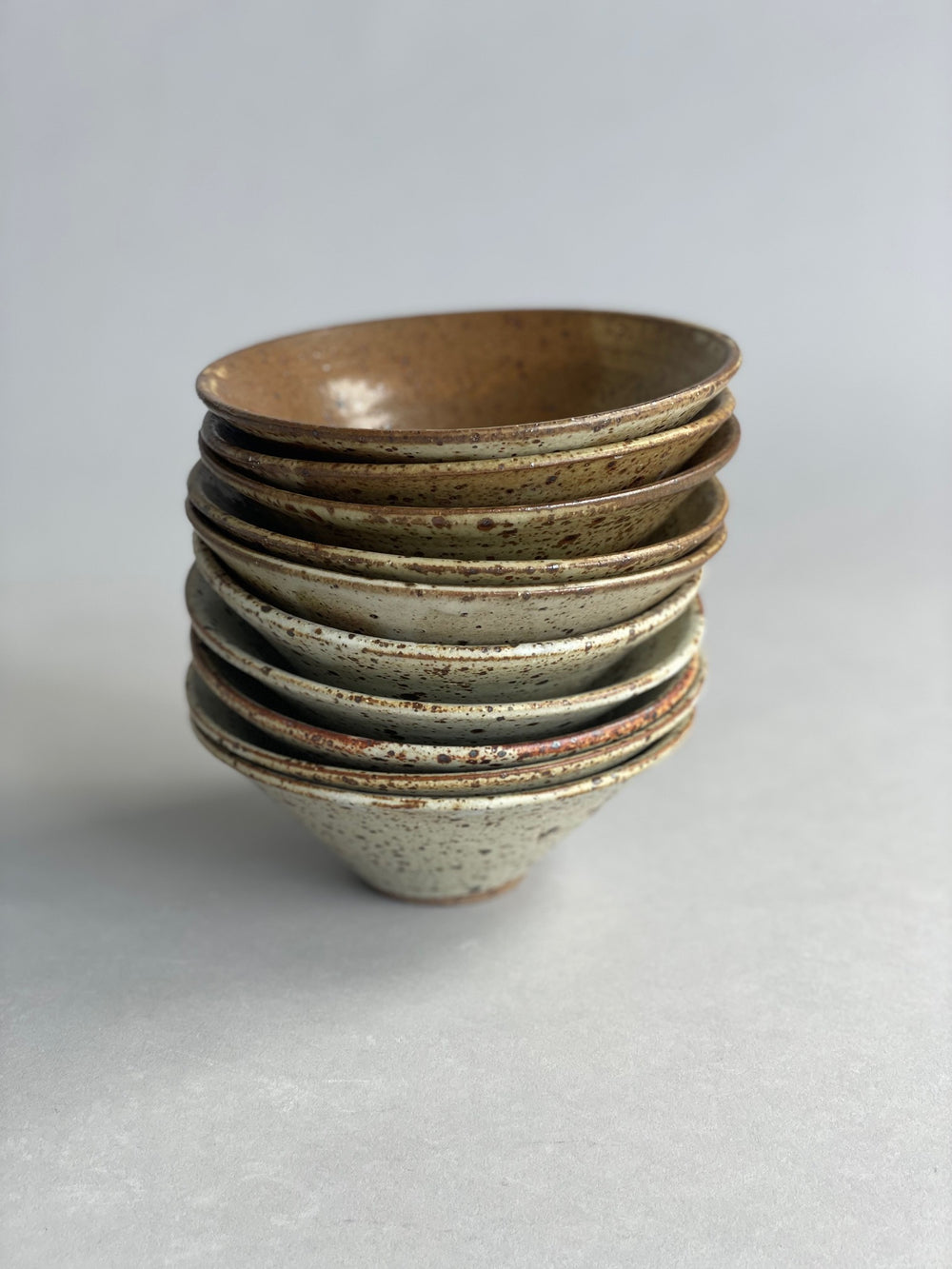 Side view of a handmade ceramic bowl, highlighting its smooth finish and minimalist design.