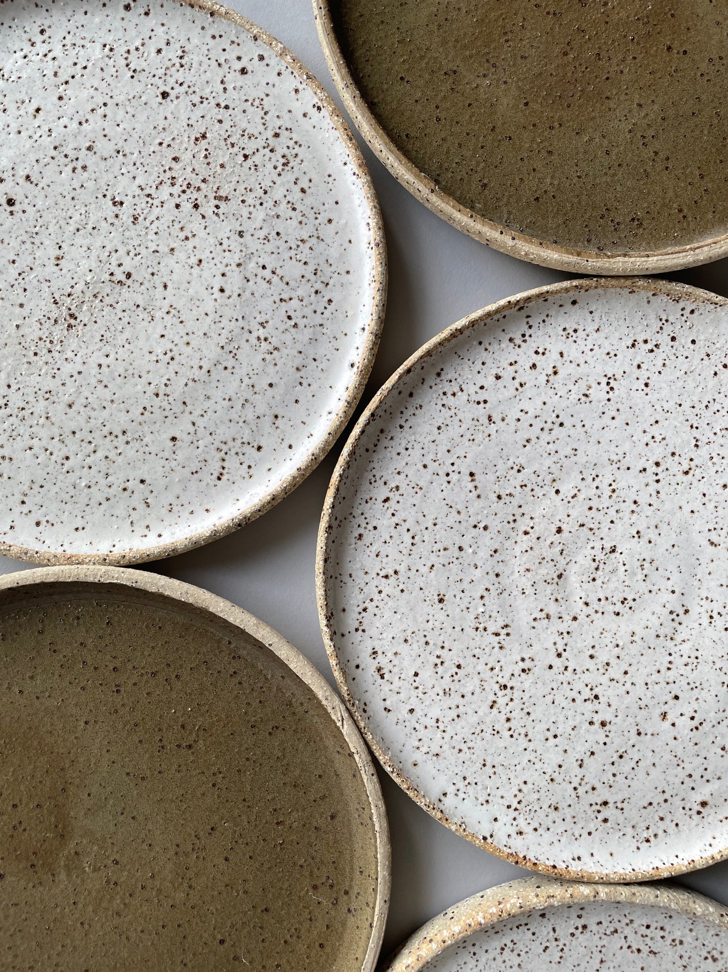 Special deep earthy green handmade plates made exclusively for Situ Studio by Auckland potter Kirsten Dryburgh.
