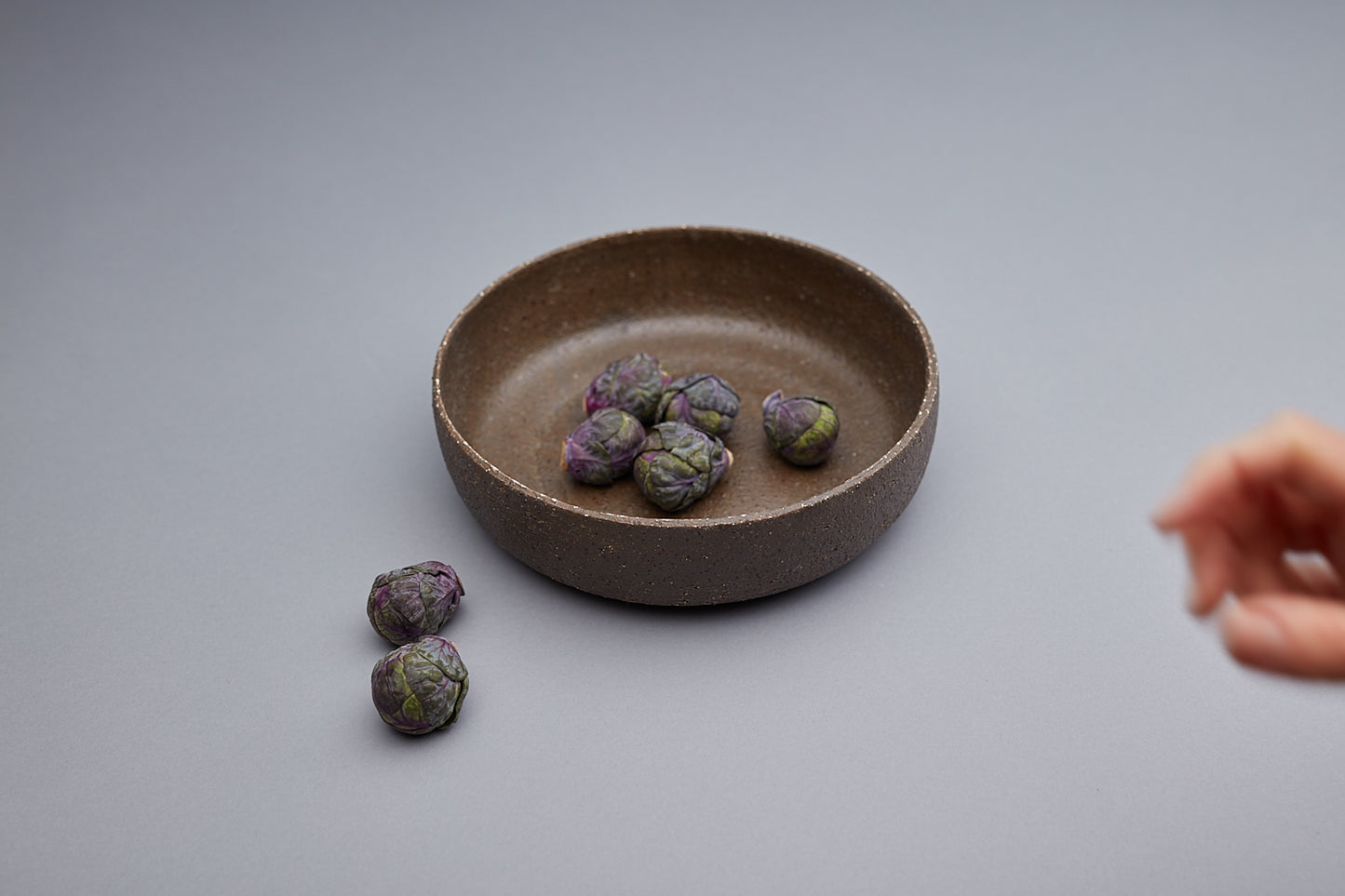 Unique textured bowls handmade by potter Kirsten Dryburgh. Vegetables are in the bowl