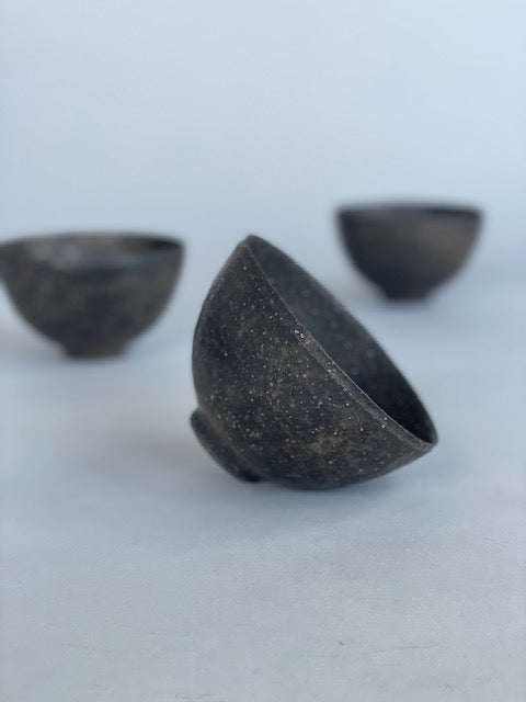 Three handmade ceramic rice bowls. Made by Takashi Endo in a textural black glaze.