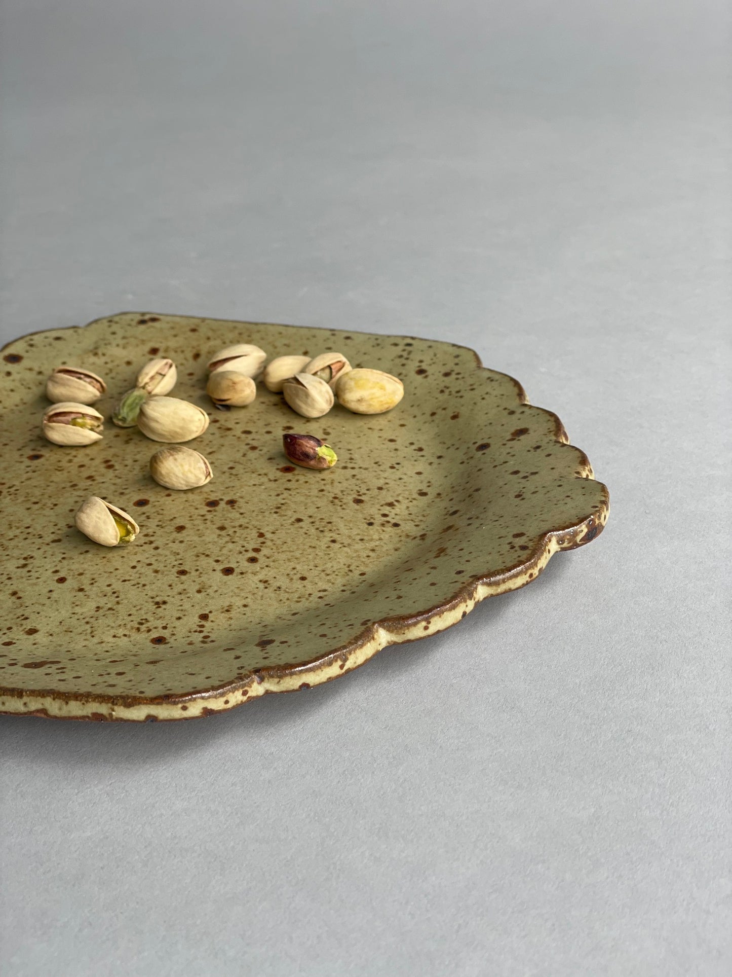 Oval ceramic plate by New Zealand maker Larisa Milsum, ideal for serving or display.