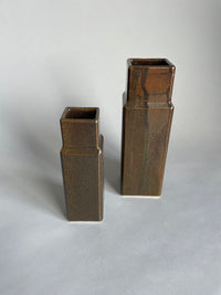 Two column vases by Misma Anaru in an  brown wairepo glaze