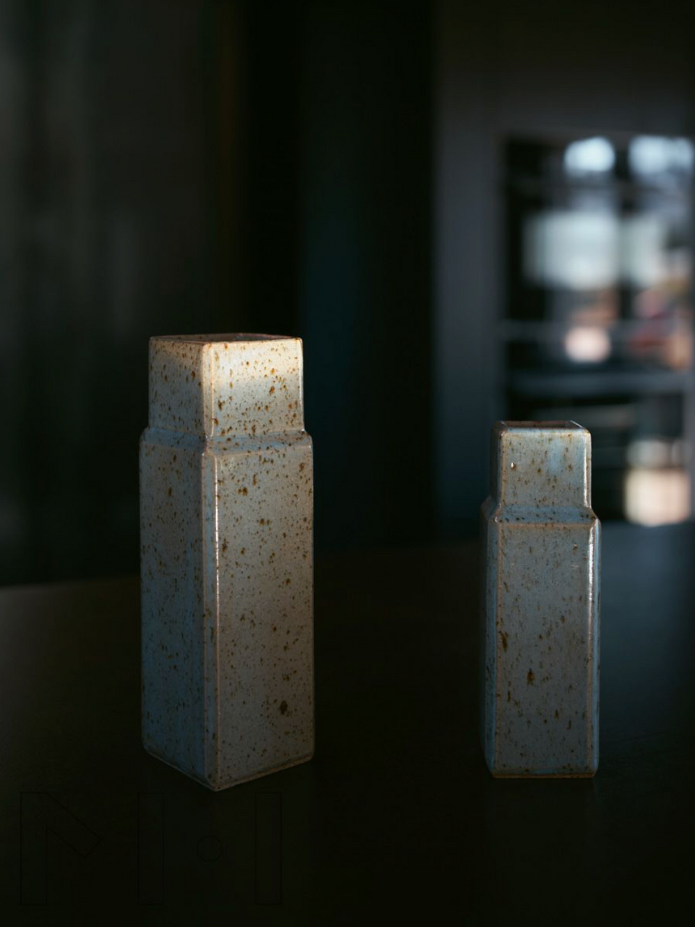 Two column vases by Misma Anaru in an estruscan blue glaze 