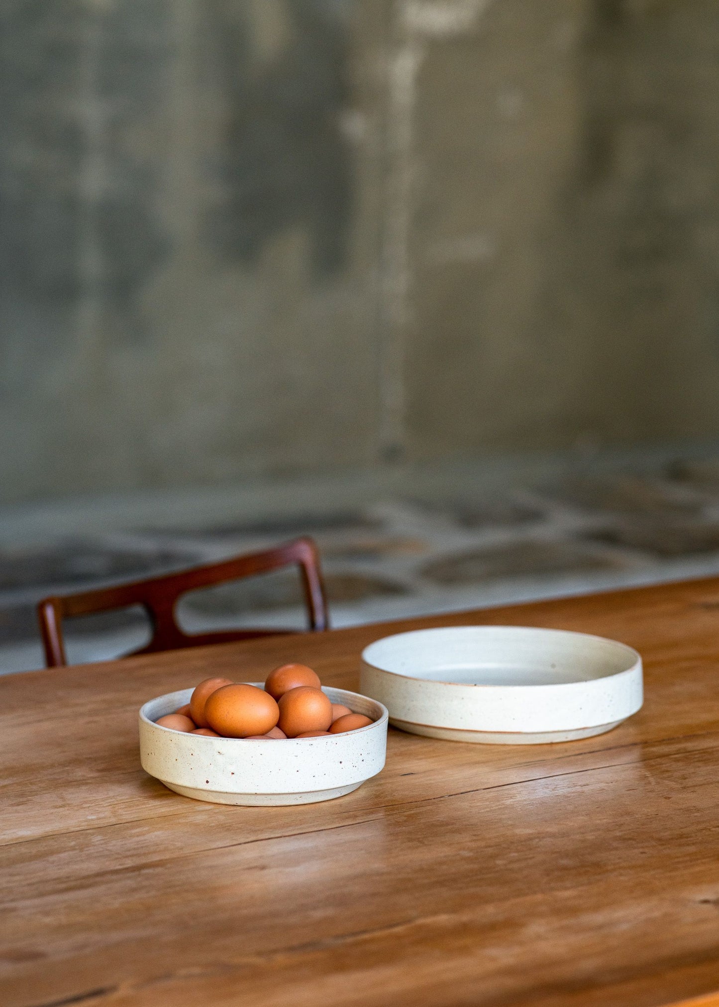 A Richard Beauchamp bowl resting on a wooden table, blending minimalist aesthetics with functionality.