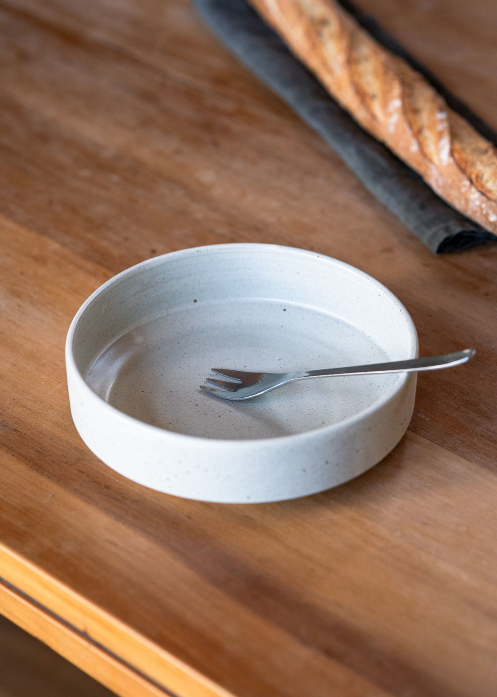 Close-up of a medium-sized ceramic bowl, perfect for serving salads or as a dinner bowl.