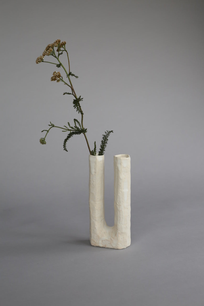 Side view of a one-of-a-kind ceramic vase, perfect as a standalone piece or for holding flowers.