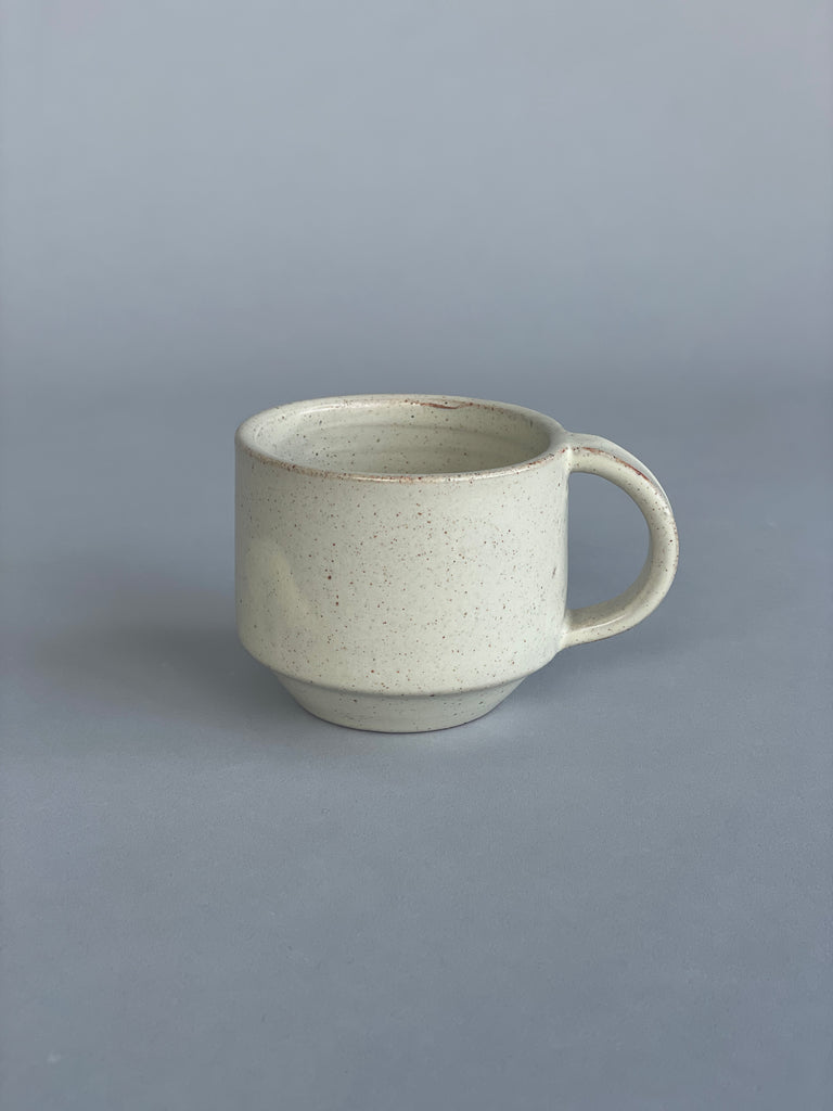 Beautiful stacking mugs in an exclusive Warm White glaze, handmade by New Zealand potter Richard Beauchamp for SITU Studio