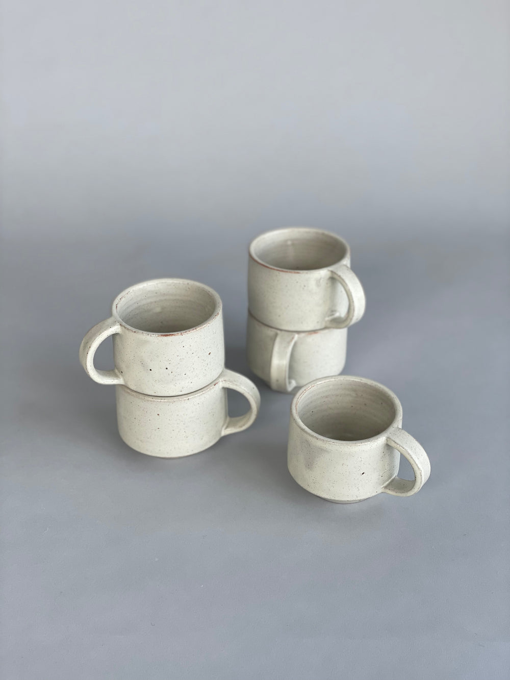 Beautiful stacking mugs in an exclusive Warm White glaze, handmade by New Zealand potter Richard Beauchamp for SITU Studio