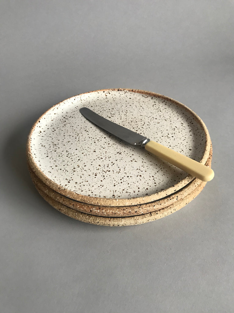 Handmade ceramic plate by Auckland potter, Kirsten Dryburgh. A unique textural white glaze is exclusive to Situ Studio..