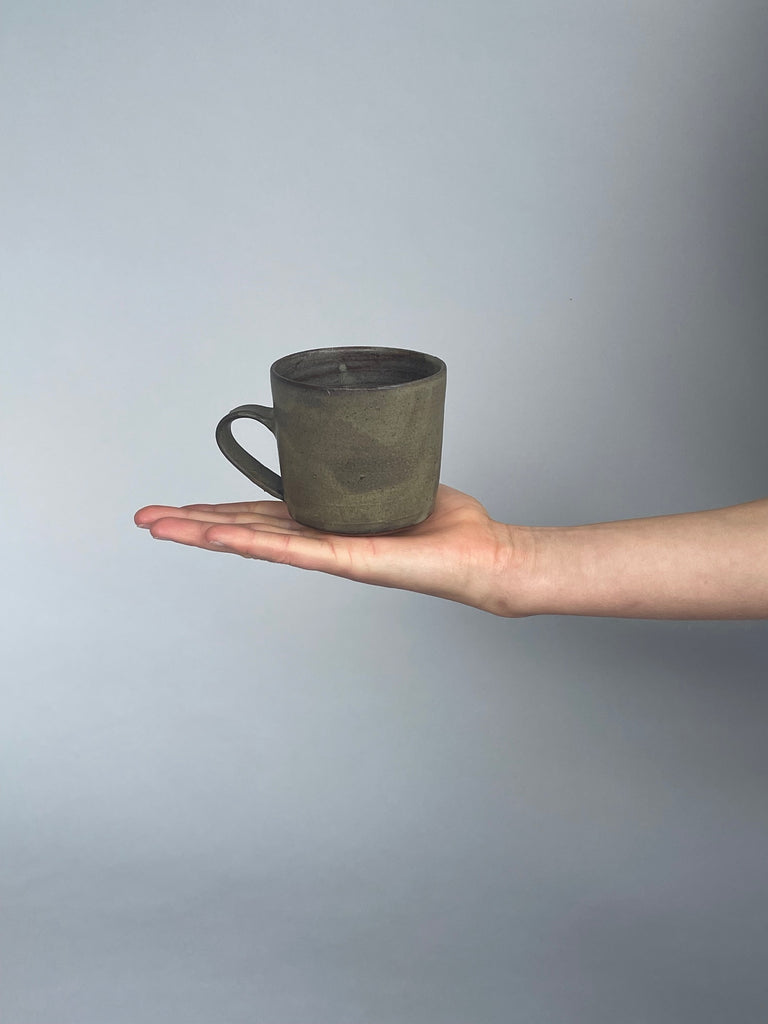 Handmade green cups made for Situ Studio by Wellington potter, Zoe Isaacs.