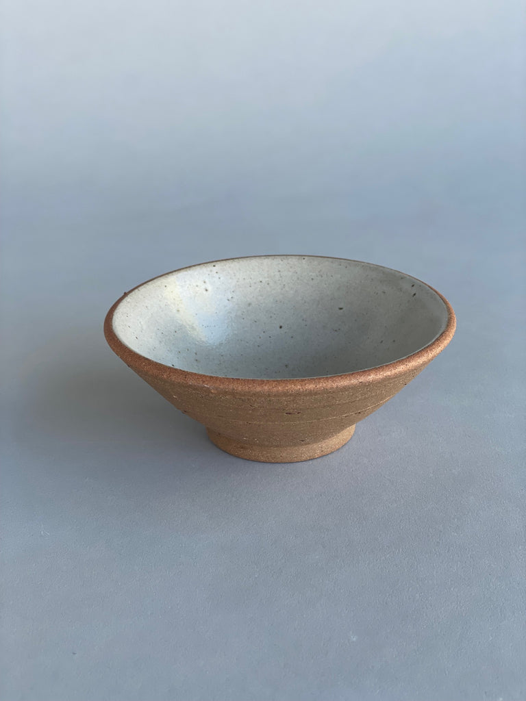 Small handmade ceramic bowls suitable for condiments and snacks. Made in New Zealand for Situ Studio by potter, Nicola Shuttleworth using a warm terracotta clay and a white glaze.