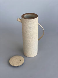 Unique handmade water jug by Japanese ceramic artist, Takashi Endo. A textured white water pot with a refined modern form