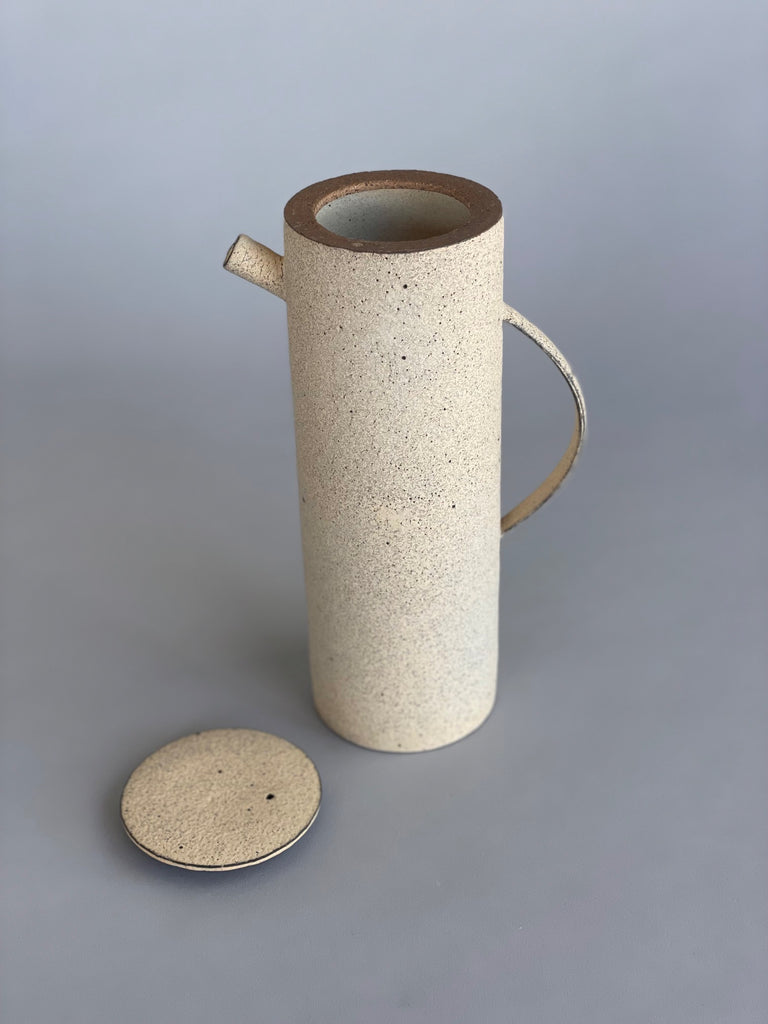 Unique handmade water jug by Japanese ceramic artist, Takashi Endo. A textured white water pot with a refined modern form