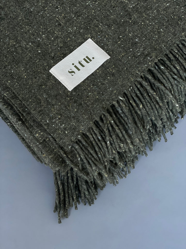 Soft merino wool blanket. Made in Donegal Ireland for SITU from a beautiful sage green tweed wool.