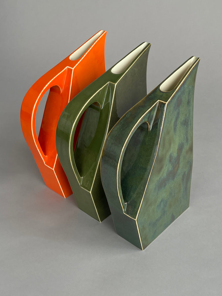 Handmade ceramic water jugs by potter Yuro Cuchor for SITU Studio. A unique modern shape available in three colours, Orange, Leaf Green & Deep Green