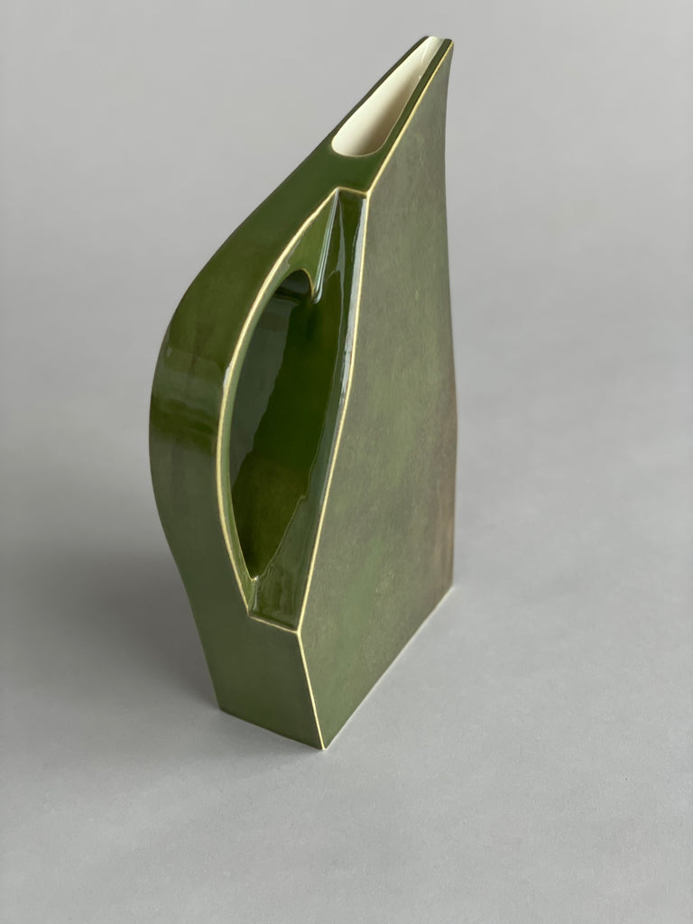 Handmade green ceramic water jug by potter Yuro Cuchor for SITU Studio. A unique modern shape available in three colours, Orange, Leaf Green & Deep Green