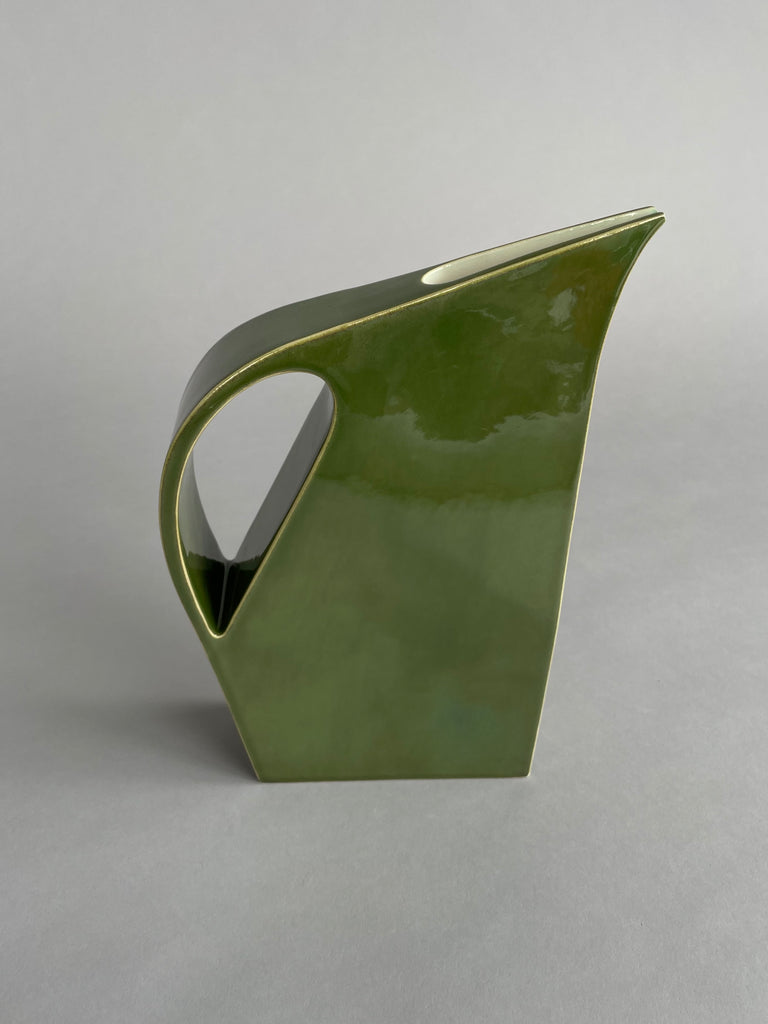 Handmade ceramic water jugs by potter Yuro Cuchor for SITU Studio. A unique modern shape available in three colours, Orange, Leaf Green & Deep Green
