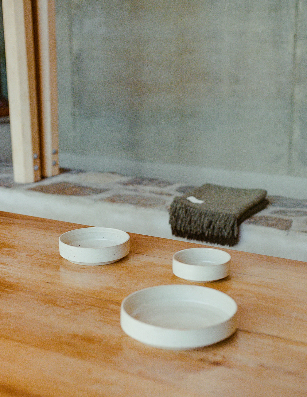 Stacked ceramic bowls in small, medium, and large sizes, showcasing their timeless and functional design.