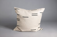 Square linen cushion from the Modern Geometry collection, featuring a screen-printed geometric design with unique placement on each piece.