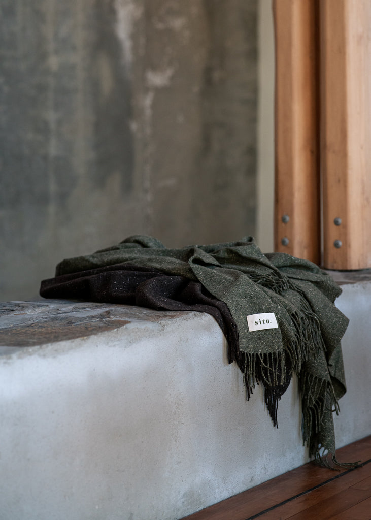 Cosy merino green wool throw. Made in Ireland exclusively for SITU Studio in limited quantities. A beautiful modern throw to suit any interior design.