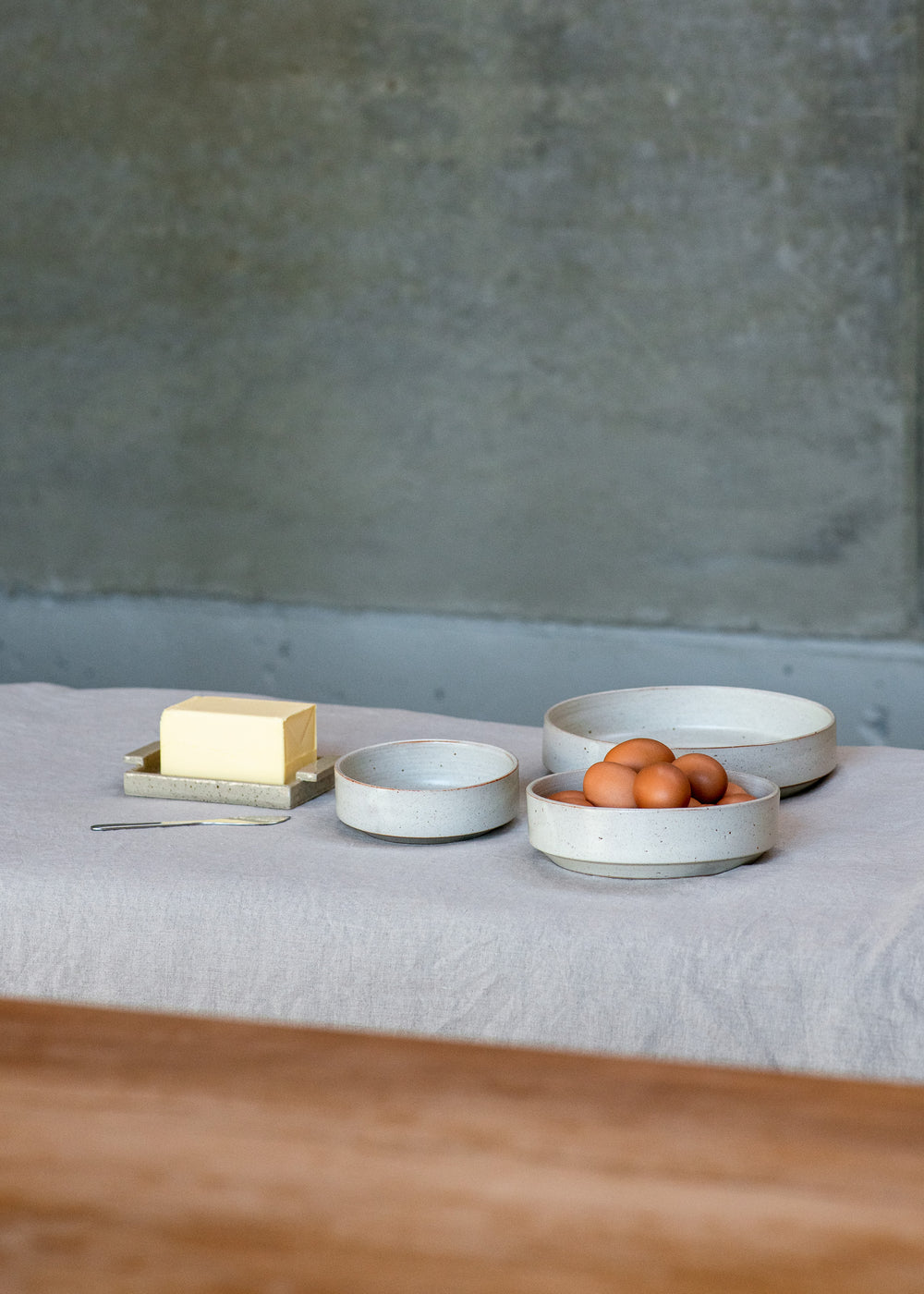 Stacked ceramic bowls in small, medium, and large sizes, showcasing their timeless and functional design.