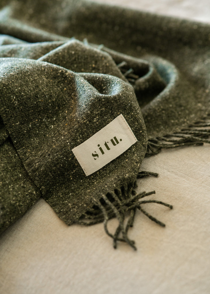 Cosy merino green wool throw. Made in Ireland exclusively for SITU Studio in limited quantities. A beautiful modern throw to suit any interior design.