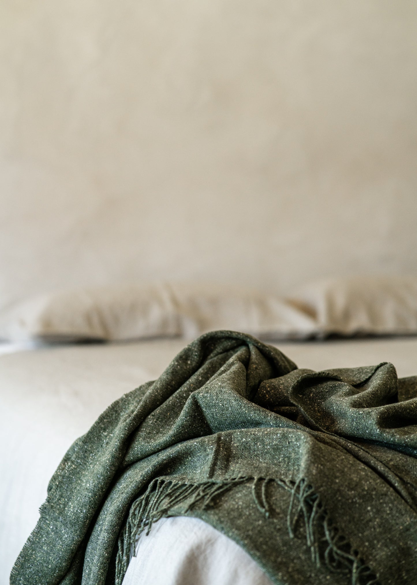 Cosy merino green wool throw. Made in Ireland exclusively for SITU Studio in limited quantities. A beautiful modern throw to suit any interior design.